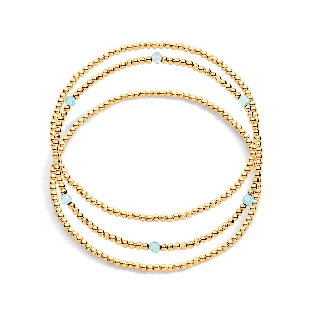 3 gold filled beaded bracelet with one having aquamarine gemstones