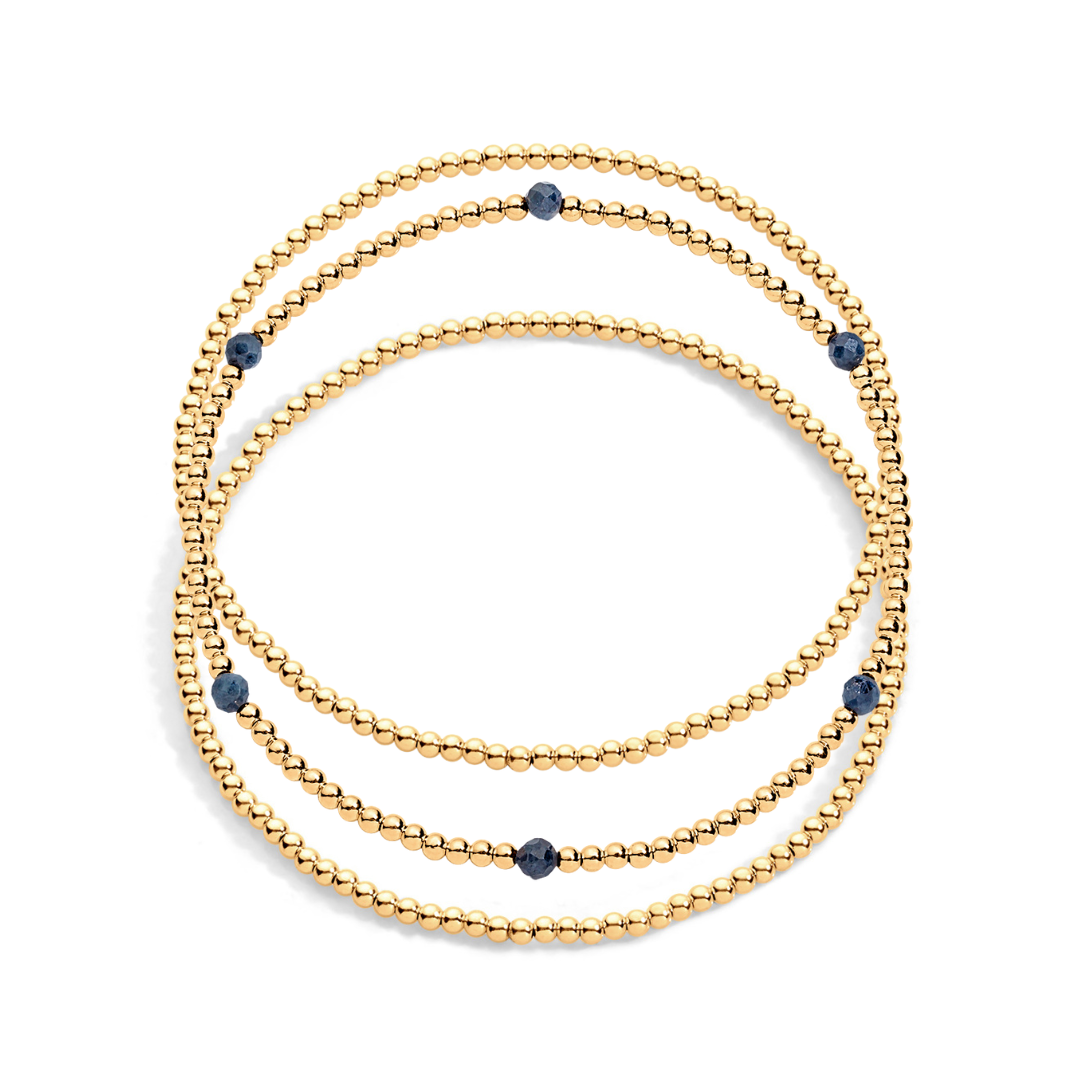 3 gold filled beaded bracelets with one having sapphire gemstones