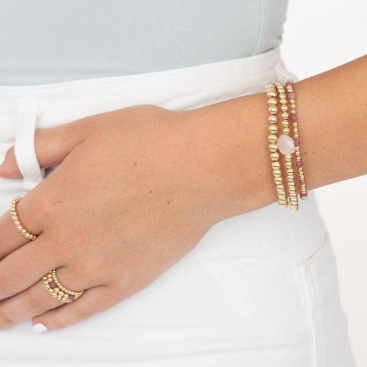 Model wearing gold filled beaded and gemstone bracelet