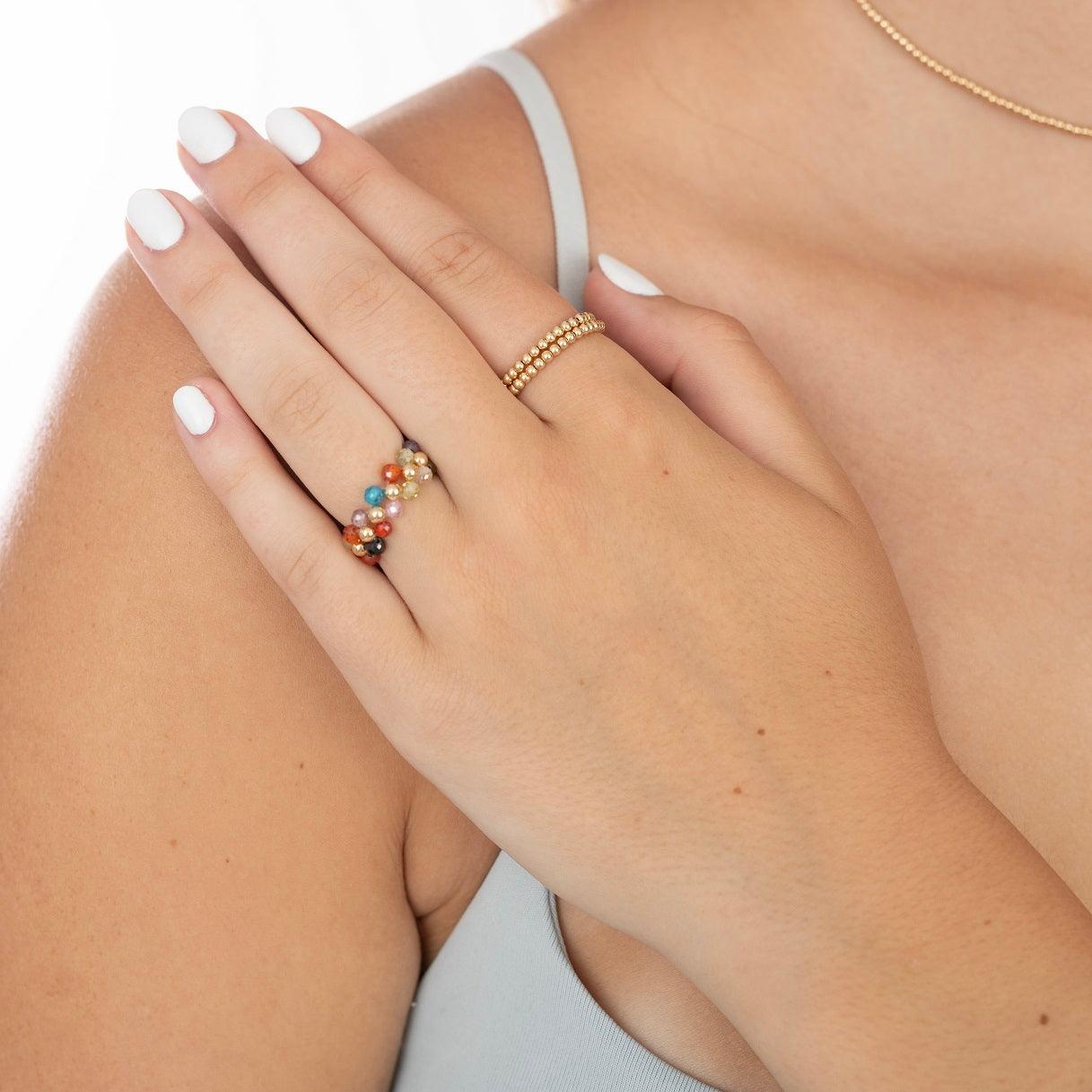 model wearing gold filled and gemstone ring