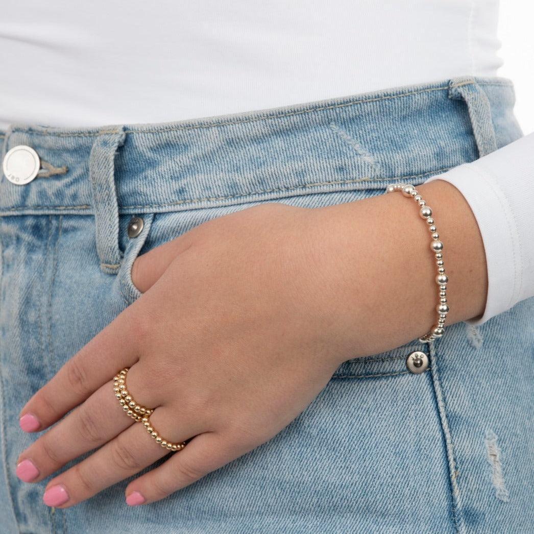 model wearing a silver bracelet